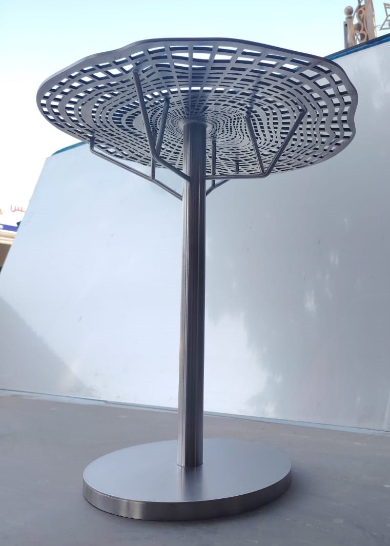 Sculptural stainless side table